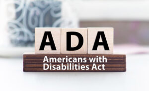 scrabble tiles reading: ADA (for the Americans with Disabilities Act)