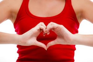 woman's hands meaking a heart shappe for February Health & Wellness