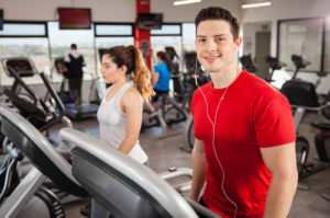 Man exercising on a treadmill at a gym to illustrate Men's Health Month