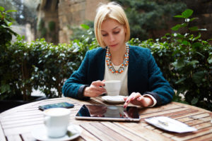 woman reading HR news on laptop