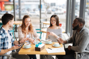 employees sharing HR news over coffee